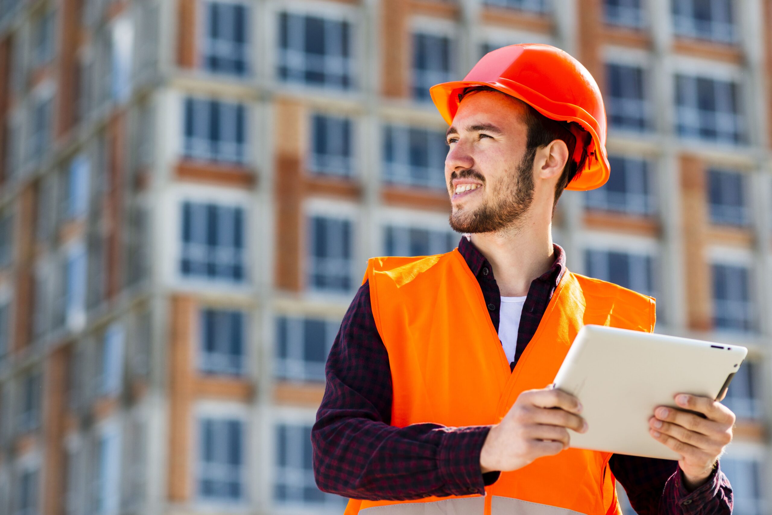 medium-shot-portrait-construction-engineer-holding-tablet (1)